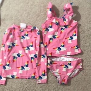 Hanna Andersson 2 piece bathing suit with matching long sleeve rash guard.